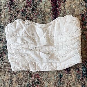 White strapless top .